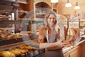 Mature female baker working at her bakery store