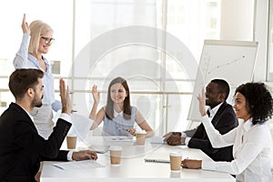 Mature female coach holding educational briefing for diverse employees