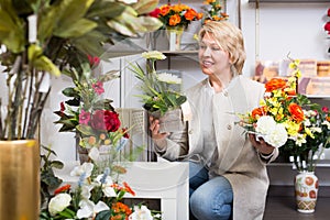 Mature female customer in floral shop