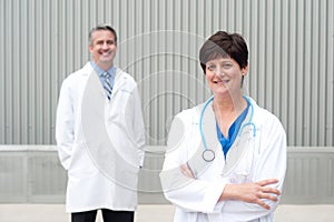 Mature female doctor with colleague