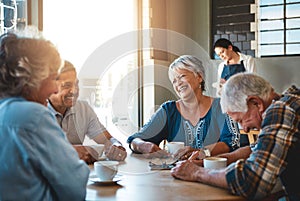 Mature, friends and group chat at cafe on holiday or relax on vacation in retirement. Senior, people and talking at cafe