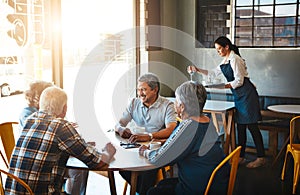Mature, friends and group relax at coffee shop on holiday or reunion on vacation in retirement. Senior, people and talk