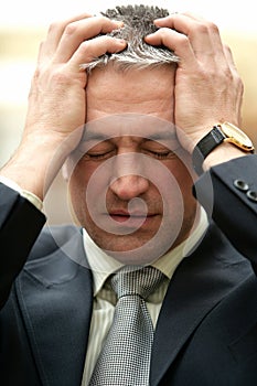 Mature frustrated worrying businessman have a problem