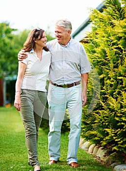 Mature, garden or happy couple hug in backyard or nature on a outdoor romantic walk for support. Wellness, smile or