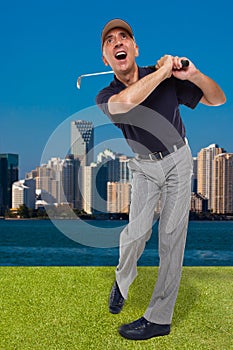 Mature golfer swinging his golf club