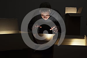 Mature greedy man opening parcels