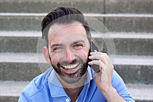 Mature guy talking on mobile phone and smiling