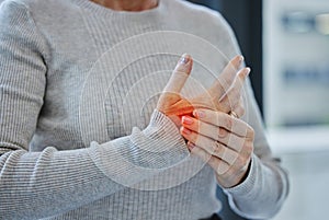 Mature, hands and pain with injury or arthritis in workplace from person, burnout and red glow in office. Tendinitis photo