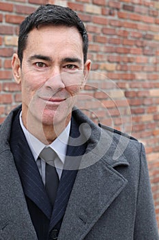Mature handsome Caucasian businessman smiling