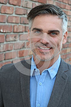 Mature handsome Caucasian businessman smiling