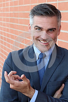 Mature handsome man smiling and laughing