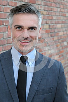 Mature handsome man smiling and laughing