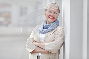 Mature happy beautiful smiling professional business woman, happy confident positive model entrepreneur standing outdoor