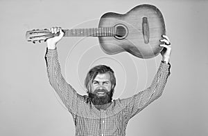 mature hipster musician with beard. brutal caucasian guy playing guitar. country music. bearded man singing song
