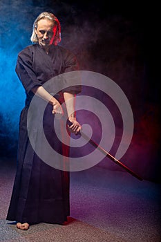 Mature kendo fighter with shinai