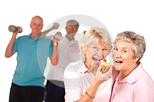 Mature ladies eating cake