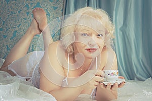 Mature lady with cup of tea