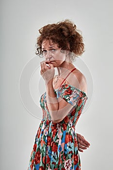 Mature lady with an expresion of doubt
