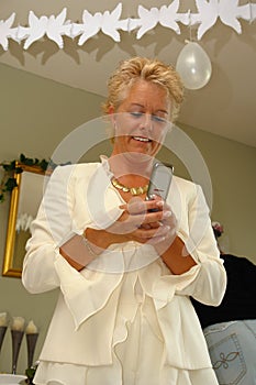 Mature lady on a party sending SMS