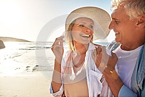 Mature love has a bliss not even imagined by newlyweds. a mature couple spending the day at the beach.