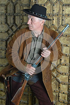 Mature male bandit with gun