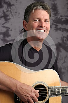 Mature Male Guitarist