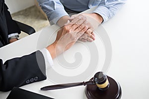 Mature male lawyer or notary with client deciding on marriage di