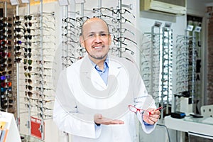 Mature male ophthalmologist working
