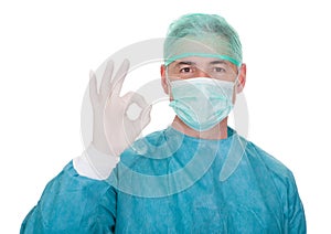 Mature male surgeon gesturing ok sign