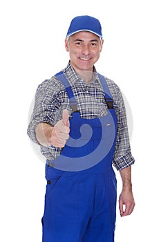 Mature male technician making thumbs up gesture