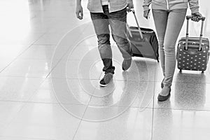 Mature man arriving with his daughter in airport looking for their pick up