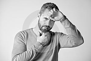 mature man with beard has heacache suffer from headahce on grey background, malaise