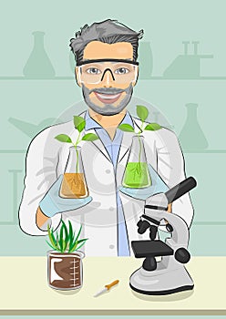 Mature man biologist with protective glasses holding two flasks with plants next to microscope in laboratory photo