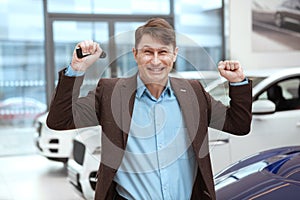 Mature man buying new car