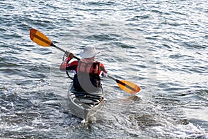 Mature man in canoe.