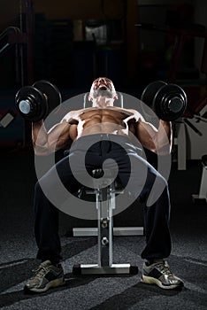 Mature Man Doing Dumbbell Incline Bench Press Workout