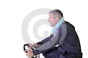 Mature man doing exercise with stationary bike