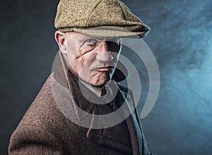 Mature man dressed as an English 1920s gangster