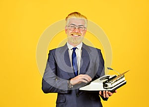 Mature man dyed beard hair. professional typist make notes. modern and old technology. digital business. vintage