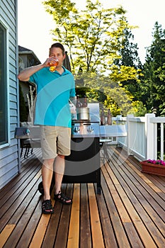 Mature Man enjoying a cold beer on nice day outdoors