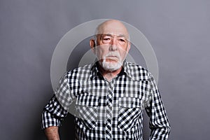 Mature man expressing disgust, grimacing