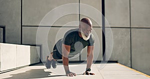 Mature, man and fitness for exercise with pushup for strength, health or wellness by outside. African person, alone and