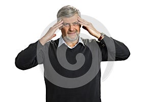 Mature man getting headache, white background.