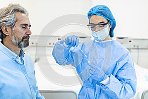 Mature man getting PCR test for coronavirus during appointment at doctor`s office. Doctor performs coronavirus swab PCR test whil