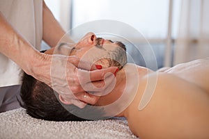 Mature man getting professional massage