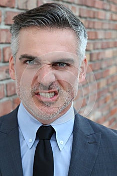 Mature man growling showing rage