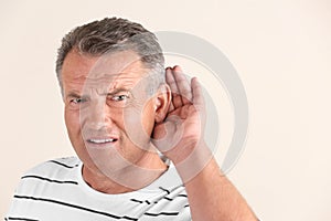 Mature man with hearing problem