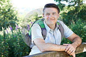 Mature Man Hiking In Countryside