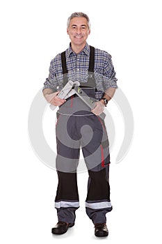 Mature man holding wrench