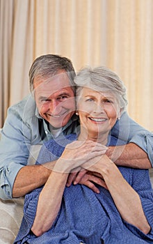 Mature man hugging his wife